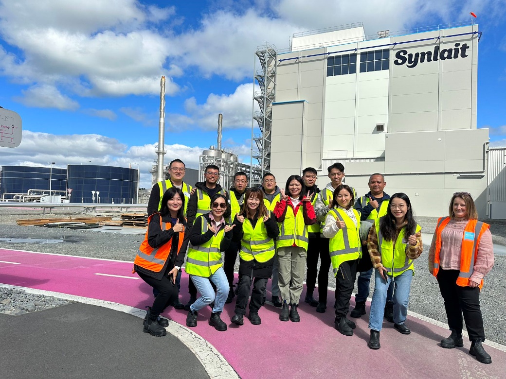 A group of people posing for a photo
Description automatically generated